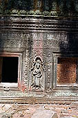 Ta Prohm temple - devatas sculpted on the gallery walls